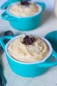 a bowl of pudding with raisins in it